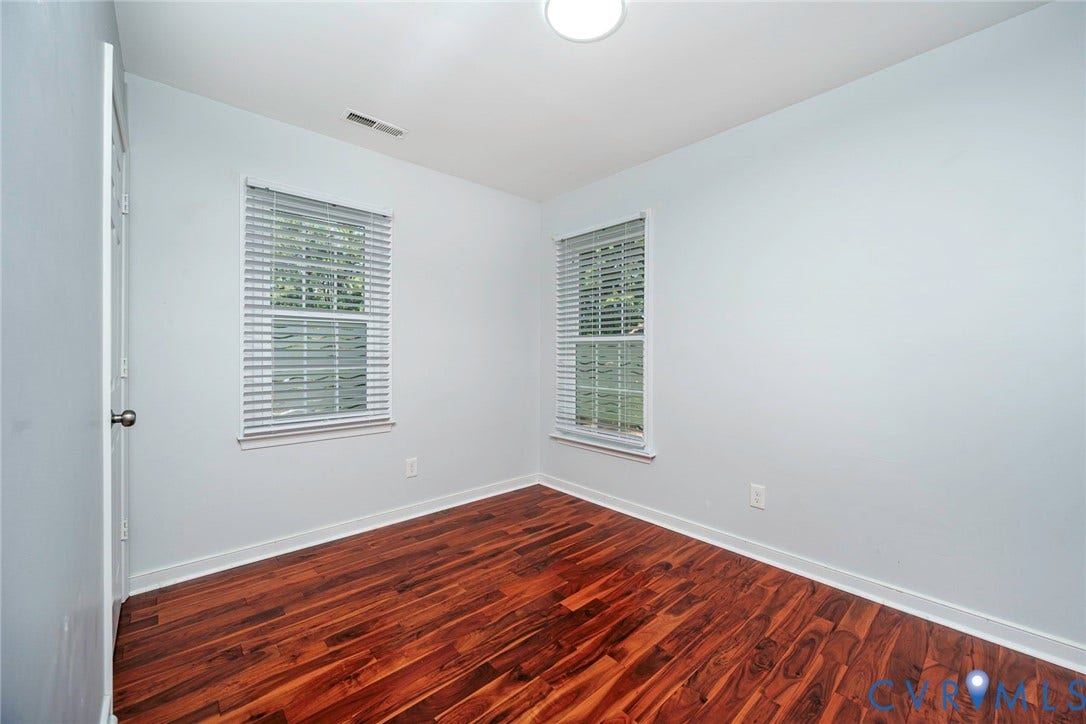 4605 English Cedar Court, Glen Allen, VA 23060 Wood-finish flooring, two windows with blinds, and white walls