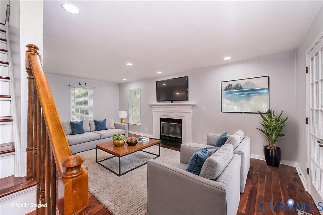 4605 English Cedar Court, Glen Allen, VA 23060 Hardwood flooring, recessed lighting, white fireplace with mantle, white French doors, and a wood staircase with balusters