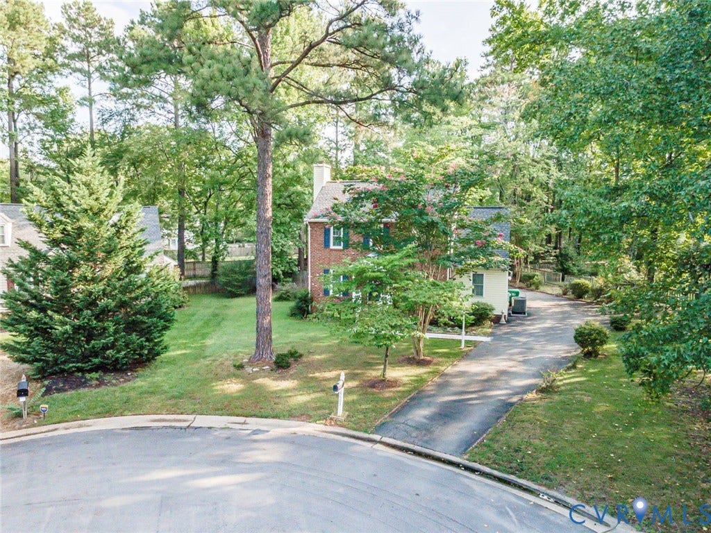 4605 English Cedar Court, Glen Allen, VA 23060 Brick exterior with white trim, green shutters, and a chimney