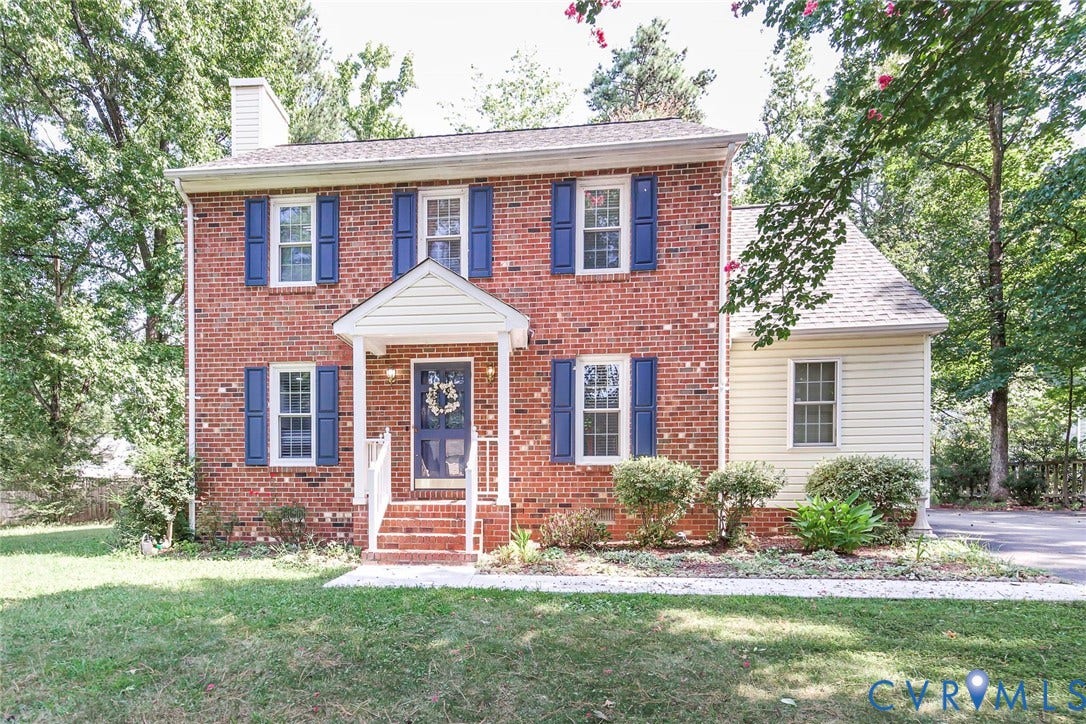 4605 English Cedar Court, Glen Allen, VA 23060 Brick facade with blue shutters, covered front entry, and an attached side structure with horizontal siding