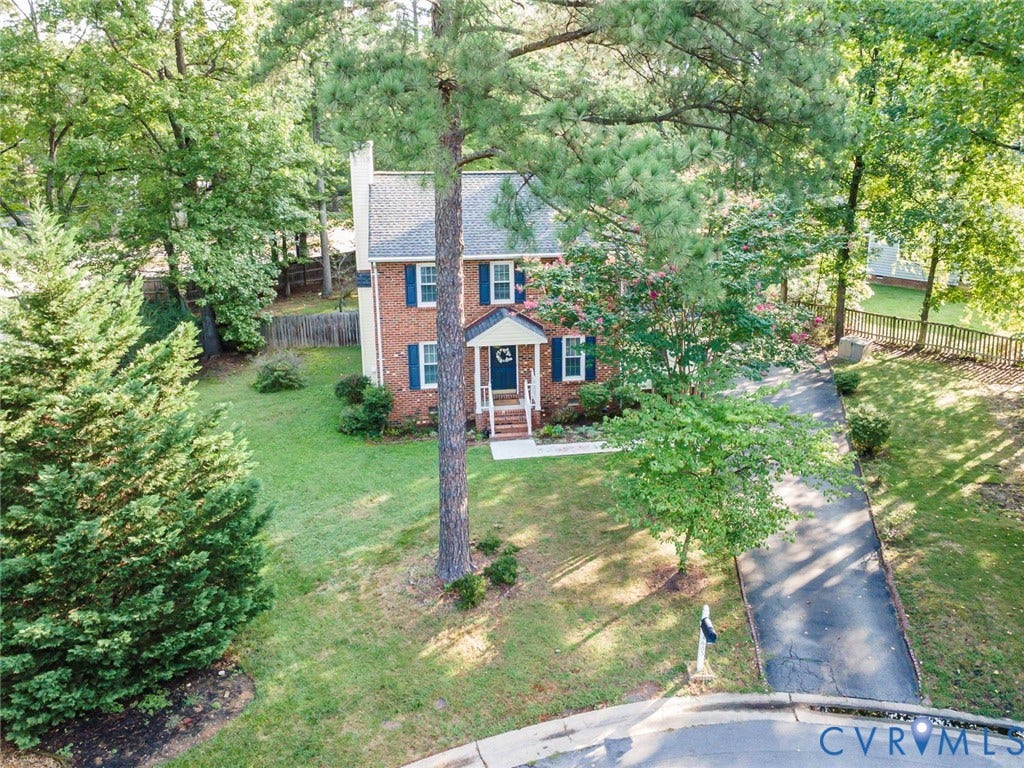 4605 English Cedar Court, Glen Allen, VA 23060 Brick exterior with blue shutters, covered front porch, and mature trees