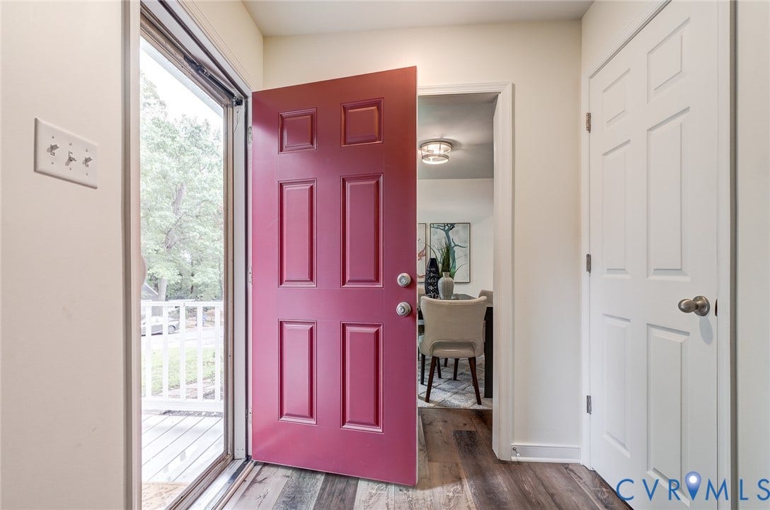 14 Redbridge Terrace, Shendoah Hills, Chesterfield, VA 23236 Bold red paneled entry door with brushed nickel hardware, wood-finish flooring, and white interior doors