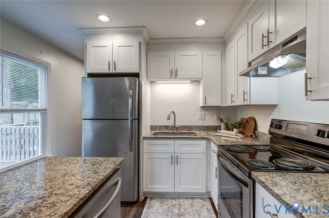 14 Redbridge Terrace, Shendoah Hills, Chesterfield, VA 23236 Crisp white cabinetry, granite counters and generous storage create a stylish, functional kitchen.