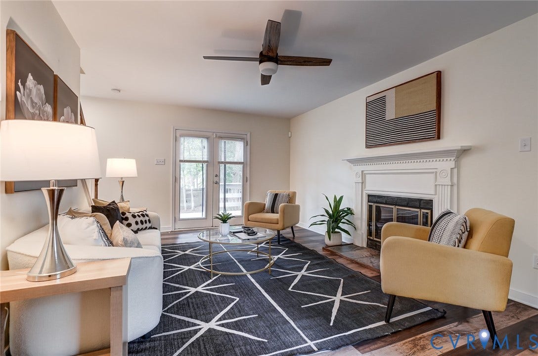 14 Redbridge Terrace, Shendoah Hills, Chesterfield, VA 23236 Spacious living room with fireplace, ceiling fan and French doors opening to the
rear deck.
