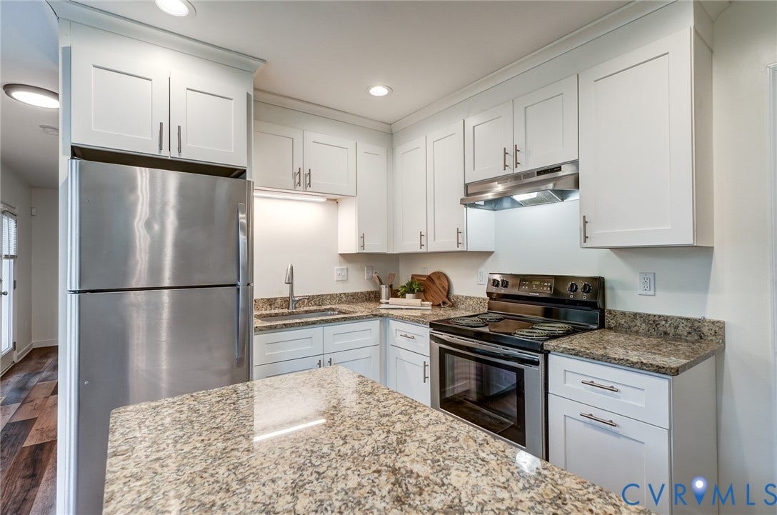 14 Redbridge Terrace, Shendoah Hills, Chesterfield, VA 23236 Kitchen featuring white shaker-style cabinetry, granite countertops, stainless steel refrigerator, stainless steel range hood, and wood-finish flooring
