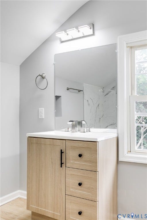 2012 Bailey Avenue, Richmond, VA 23231 Vanity with a light wood-finish cabinet, white countertop, and contemporary fixtures
