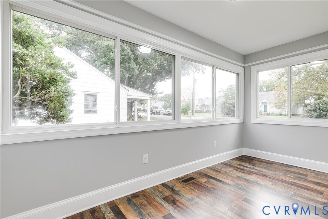 2012 Bailey Avenue, Richmond, VA 23231 Wood-finish flooring, white trim, light gray walls, and multiple windows