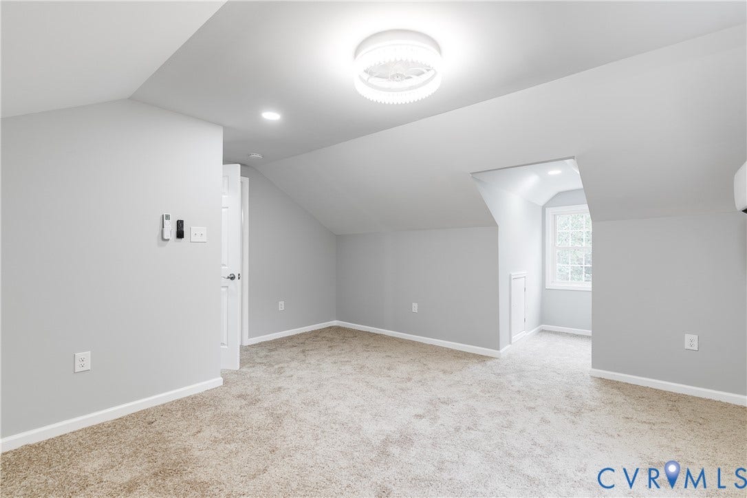2012 Bailey Avenue, Richmond, VA 23231 Sloped ceilings, recessed lighting, white interior door, wall-mounted air conditioning unit, and a window with natural light