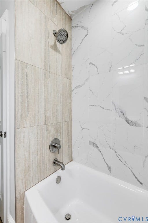 2012 Bailey Avenue, Richmond, VA 23231 Bathtub with chrome fixtures, two-tone tile surround, and a coordinating shower head