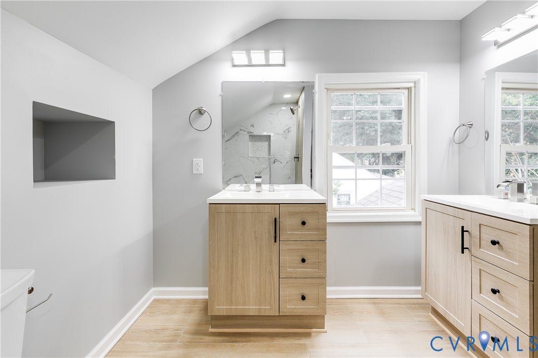 2012 Bailey Avenue, Richmond, VA 23231 Dual wood-finish vanities with white countertops, integrated sinks, and matte black hardware