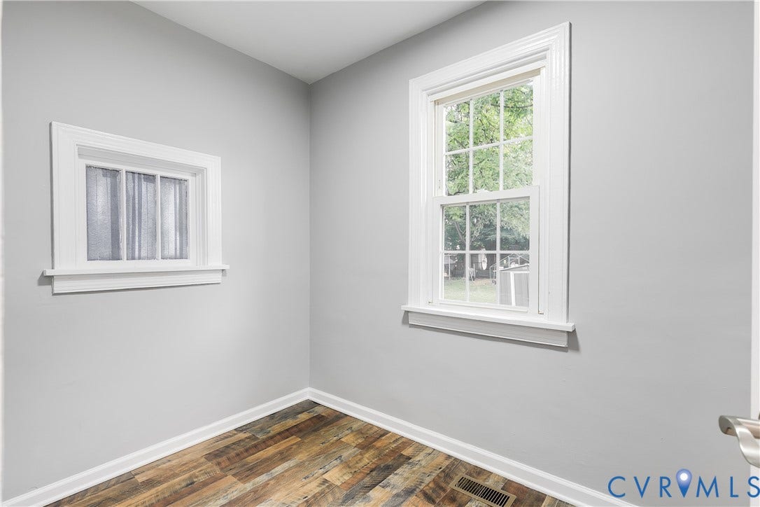 2012 Bailey Avenue, Richmond, VA 23231 Wood-finish flooring, light gray wall paint, and white window trim