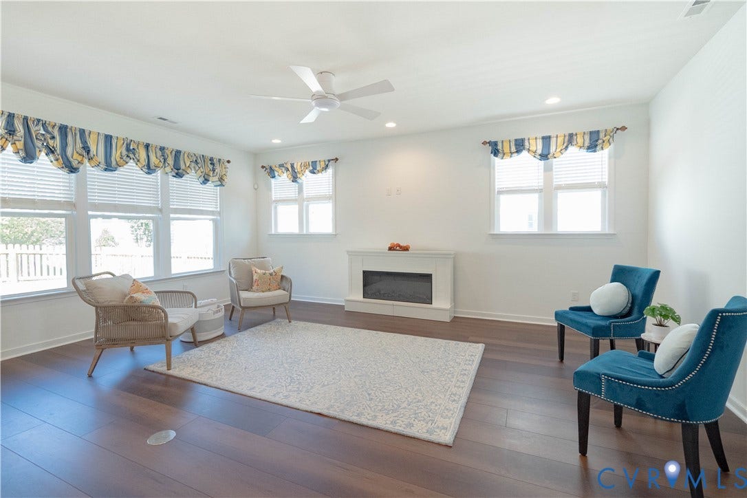 Wood-finish flooring, recessed lighting, and a ceiling fan