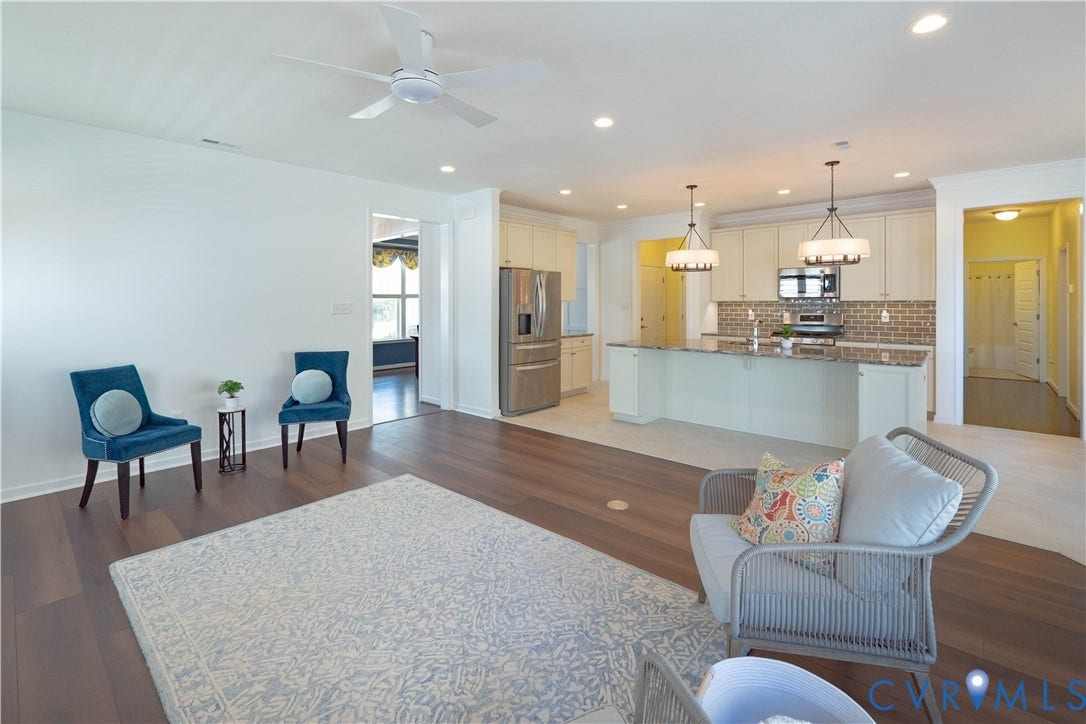 Hardwood-finish flooring throughout, recessed lighting, and a contemporary ceiling fan