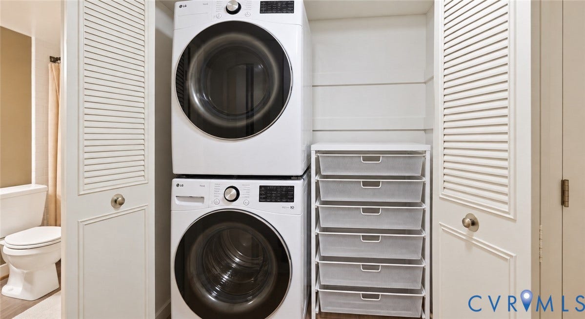 2203 Rockwater Terrace, Henrico, VA 23238 Stacked washer and dryer units, white louvered bifold doors, and integrated wire drawer storage