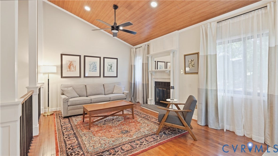 2203 Rockwater Terrace, Henrico, VA 23238 Vaulted wood-paneled ceiling with a ceiling fan, hardwood flooring, and a fireplace with a mantel