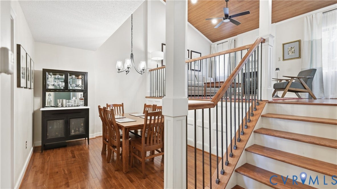 2203 Rockwater Terrace, Henrico, VA 23238 Wood-finish flooring throughout, a vaulted wood-paneled ceiling, and a staircase with wood treads and wrought iron spindles