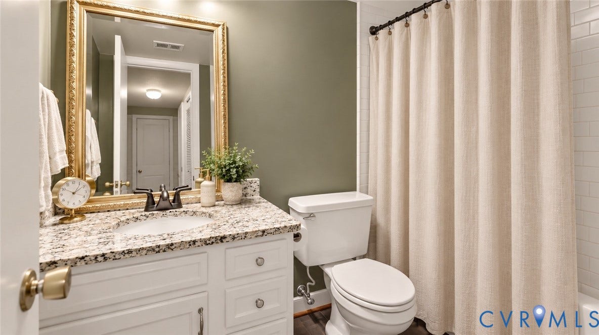 2203 Rockwater Terrace, Henrico, VA 23238 White vanity with a granite countertop, undermount sink, and dark bronze faucet