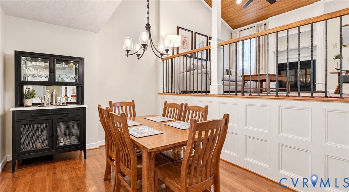 2203 Rockwater Terrace, Henrico, VA 23238 Hardwood flooring, vaulted ceiling, traditional chandelier, wainscoting, and wrought iron balusters