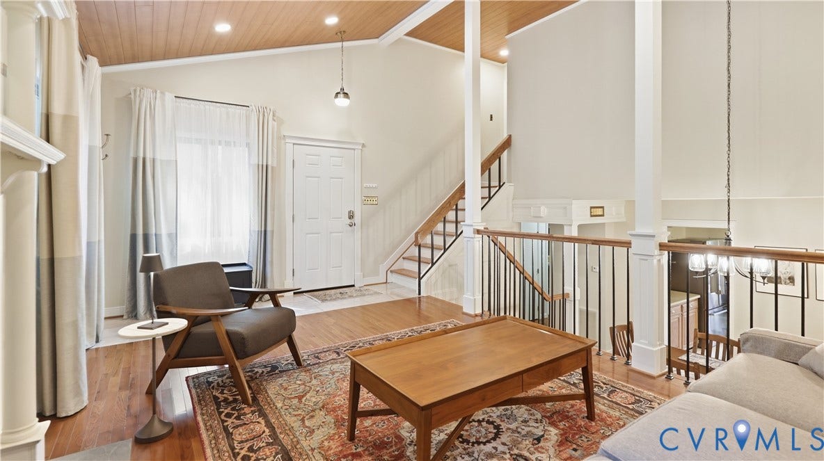 2203 Rockwater Terrace, Henrico, VA 23238 Vaulted wood-paneled ceiling, hardwood flooring, white paneled entry door, painted balusters with wood handrail, and recessed lighting