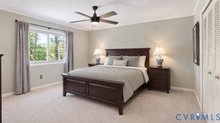 2203 Rockwater Terrace, Henrico, VA 23238 Wall-to-wall carpeting, window with natural scenery, ceiling fan with integrated lighting, and louvered bifold closet doors