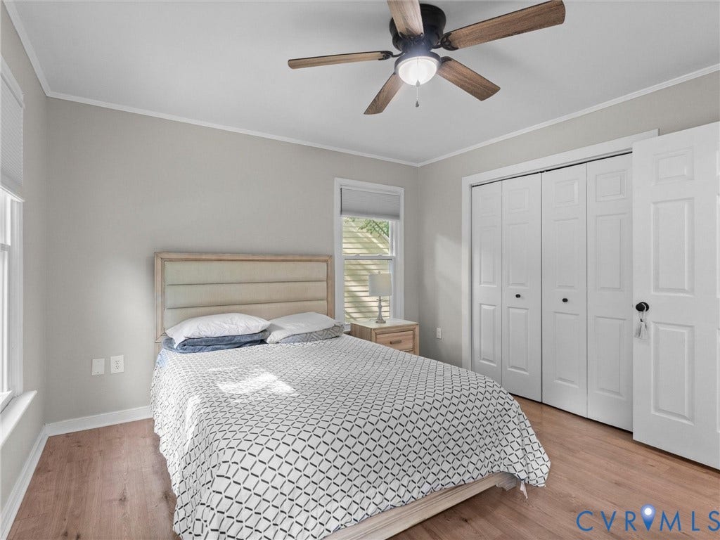 Wood-finish flooring with light gray walls and white trim