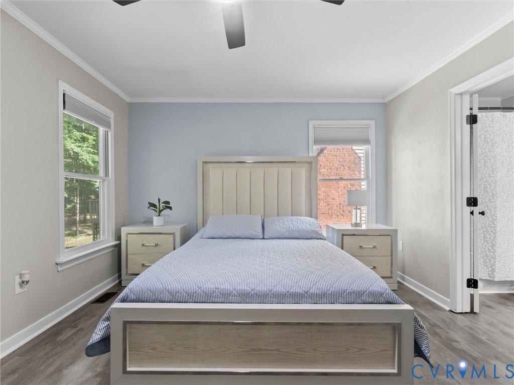 Crown molding, wood-finish flooring, ceiling fan, and double-hung windows