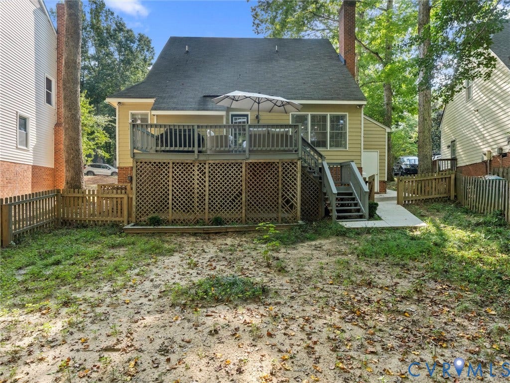 Raised deck with lattice skirting and staircase access to ground level