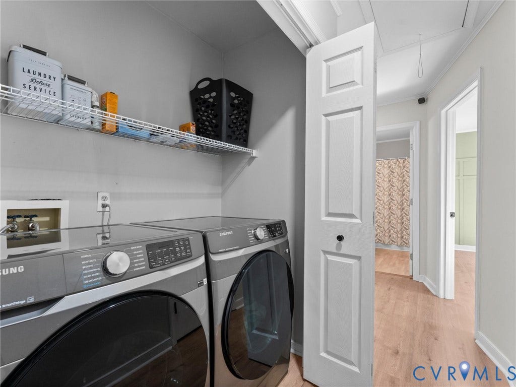 Laundry closet with wire shelving and wood-finish flooring