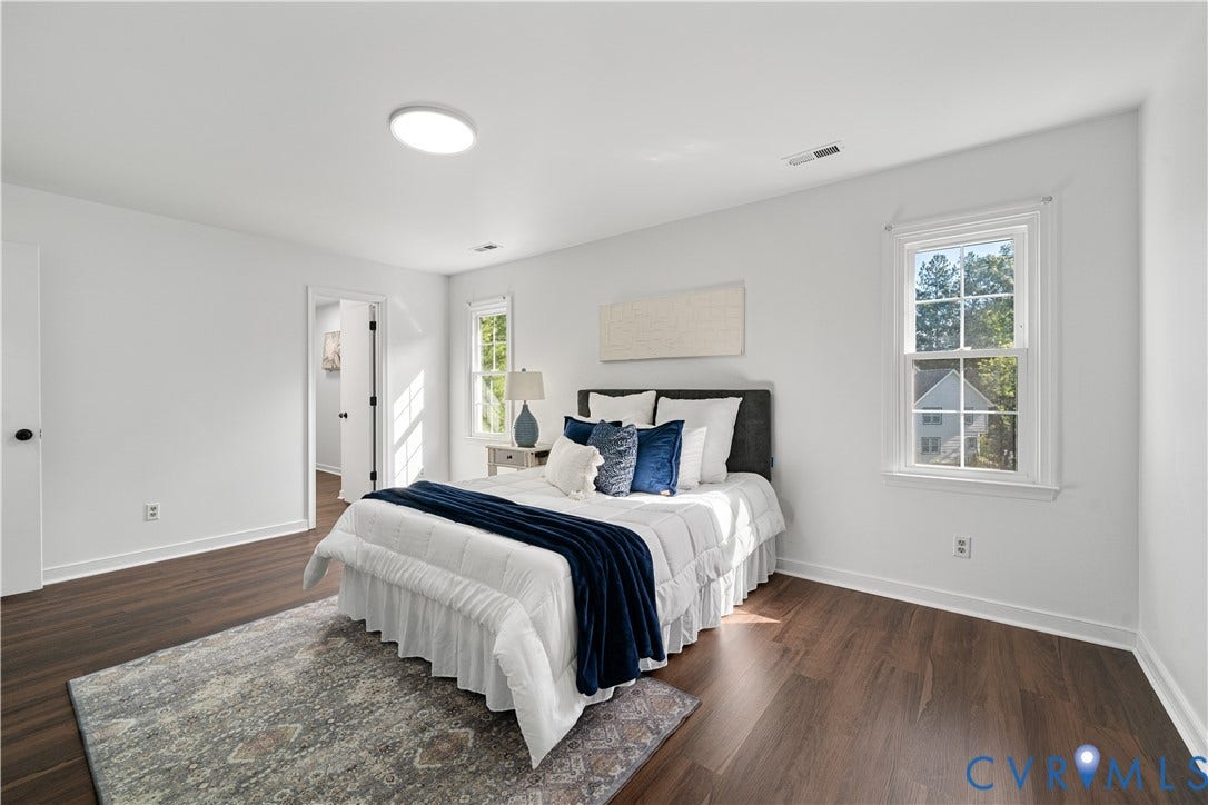 8414 Whirlaway Drive, Matoaca, Midlothian, VA 23112 Recessed ceiling light, white walls, dark wood-finish flooring, white window trim, and white baseboards