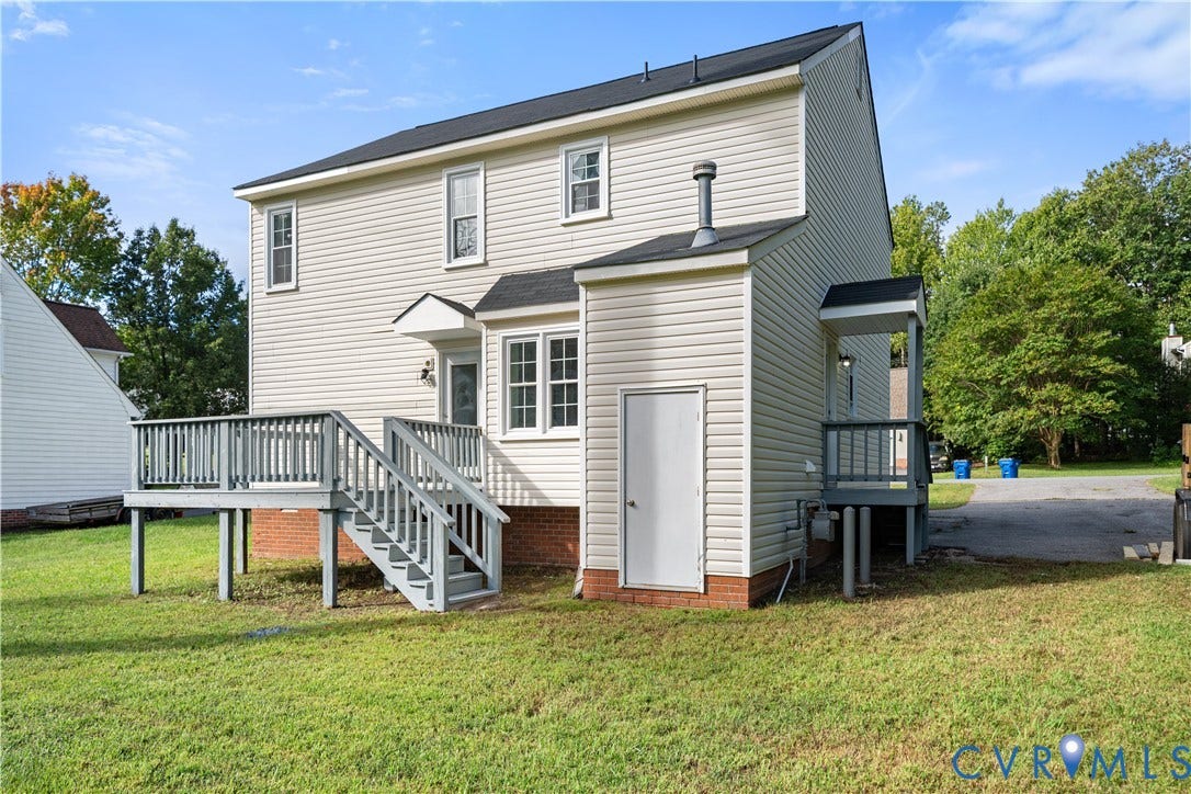 8414 Whirlaway Drive, Matoaca, Midlothian, VA 23112 Expansive back deck with stairs, white siding, multiple windows, and a secondary covered entrance