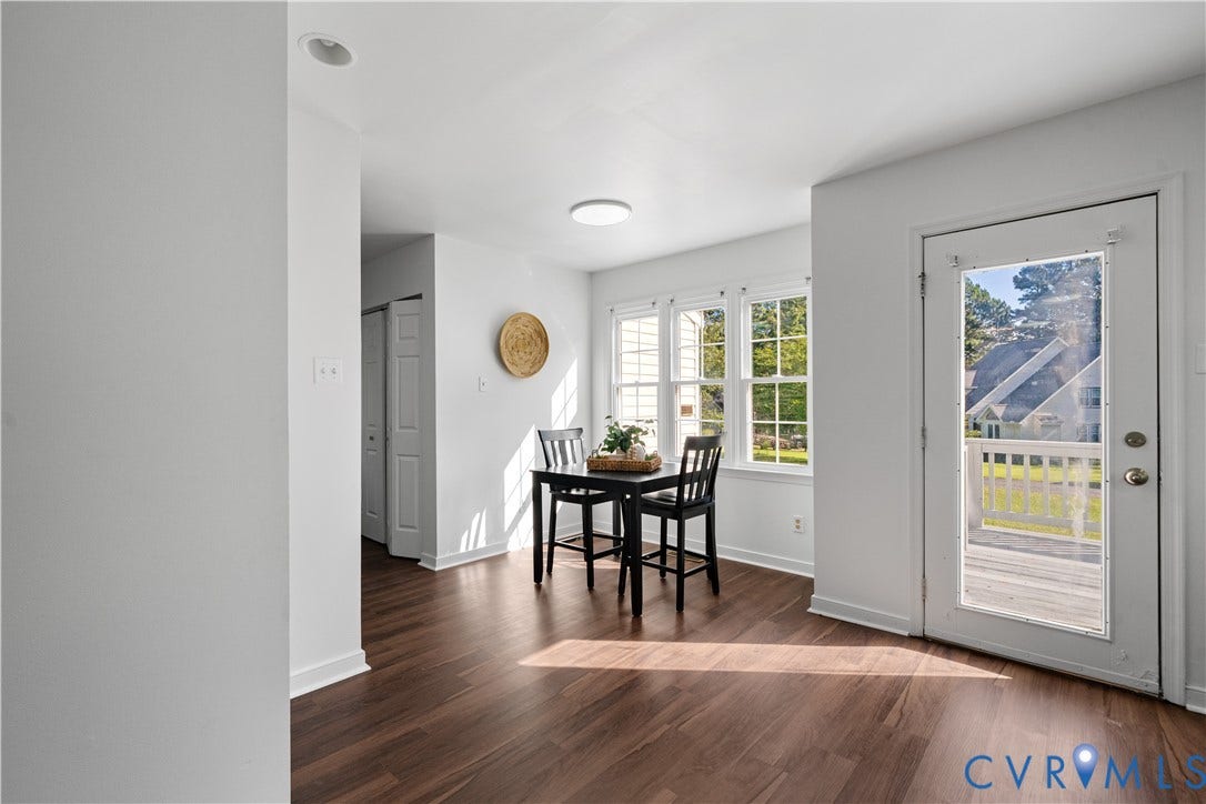 8414 Whirlaway Drive, Matoaca, Midlothian, VA 23112 Wood-finish flooring, white walls, multiple windows, recessed lighting, and a glass-paneled door