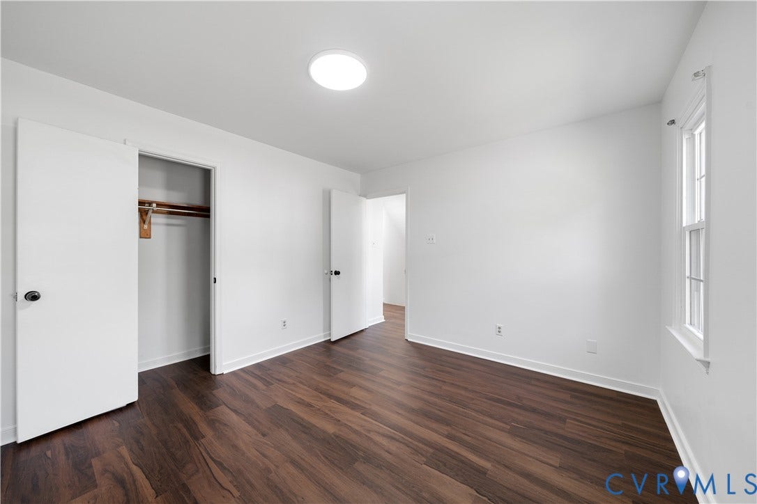8414 Whirlaway Drive, Matoaca, Midlothian, VA 23112 Hardwood-finish flooring, recessed ceiling light, white walls, double-door closet with shelving, and a single-pane window