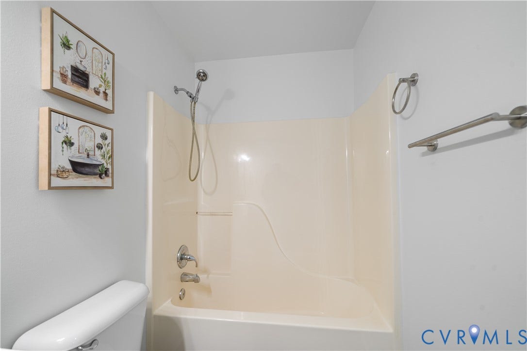 8414 Whirlaway Drive, Matoaca, Midlothian, VA 23112 Tub/shower combination with a single-handle faucet and handheld showerhead