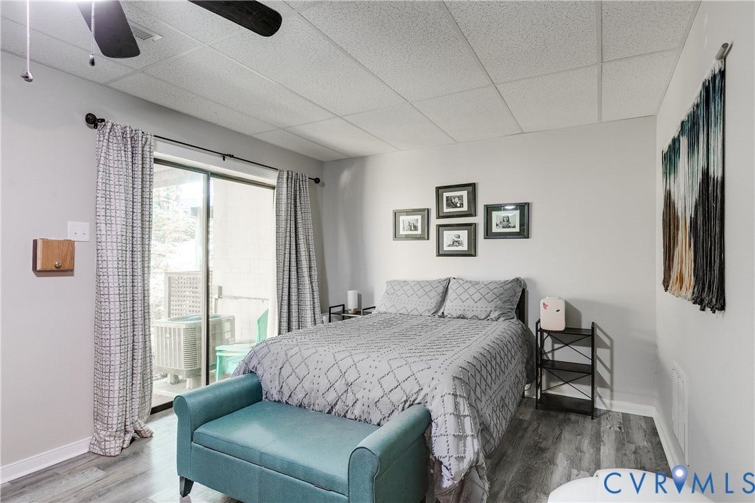 Versatile finished room featuring wood-finish LVP flooring, recessed lighting, a ceiling fan, and crisp white trim
