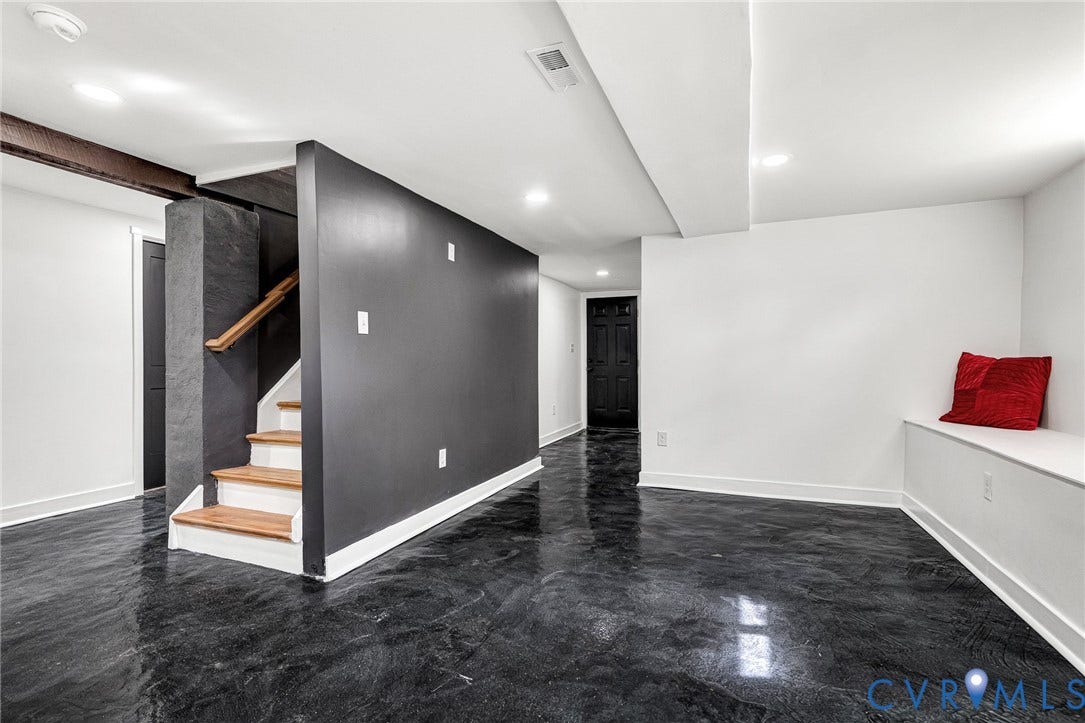 503 Pollock Street, Richmond, VA 23222 Polished dark flooring, recessed lighting, built-in bench seating, wood-finish staircase, and exposed structural beam