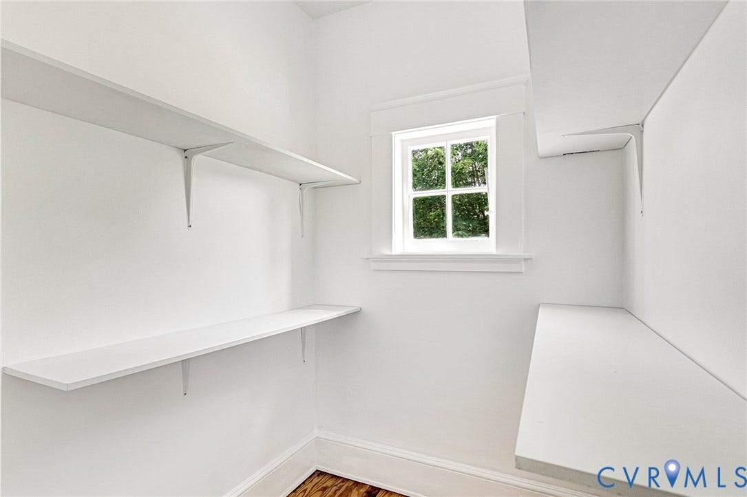 503 Pollock Street, Richmond, VA 23222 White built-in shelving, natural light from a double-hung window, and wood-finish flooring