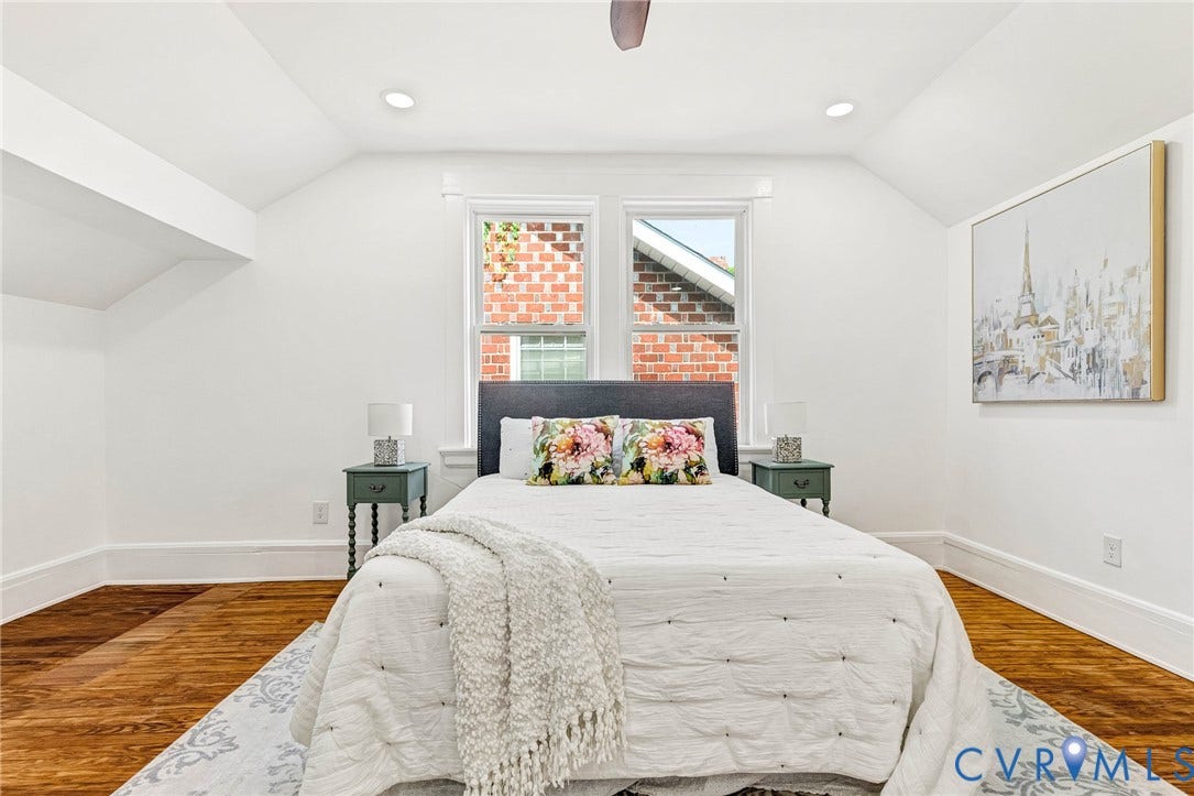 503 Pollock Street, Richmond, VA 23222 Hardwood flooring, recessed ceiling lighting, window with brick exterior, angled ceilings, and a ceiling fan
