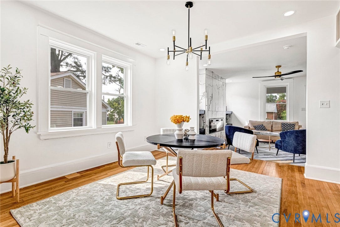 503 Pollock Street, Richmond, VA 23222 Hardwood flooring throughout, modern chandelier, recessed lighting, and a contemporary fireplace with a marble-finish surround