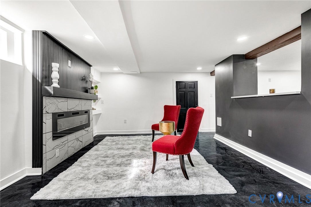 503 Pollock Street, Richmond, VA 23222 Built-in electric fireplace with stone-look tile surround and dark paneling
