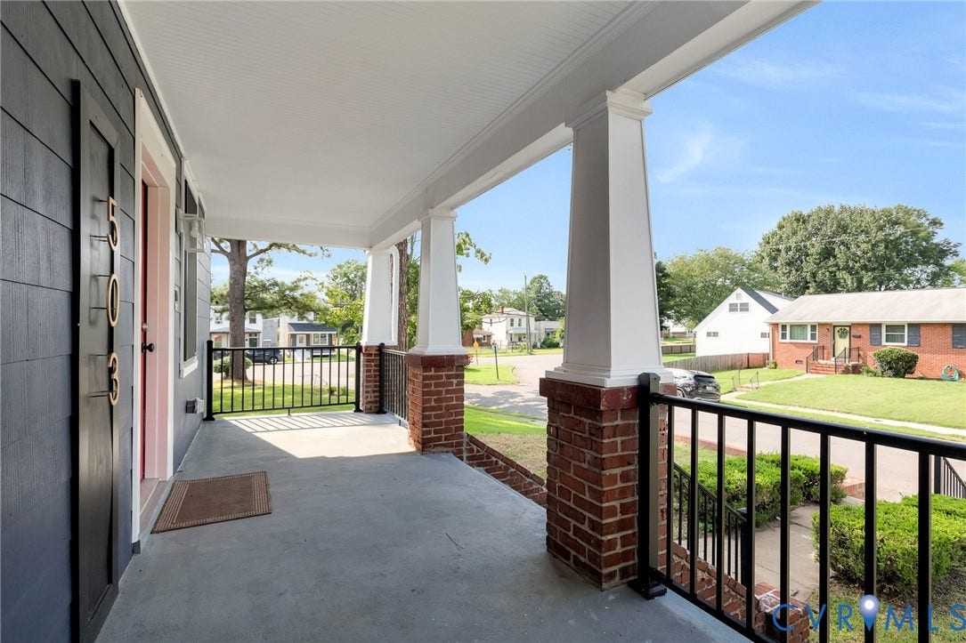 503 Pollock Street, Richmond, VA 23222 Covered front porch featuring concrete flooring, brick pillars with white columns, and black metal railings