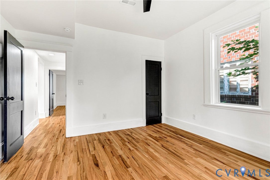 503 Pollock Street, Richmond, VA 23222 Hardwood flooring, painted interior doors, white trim, and a white window frame