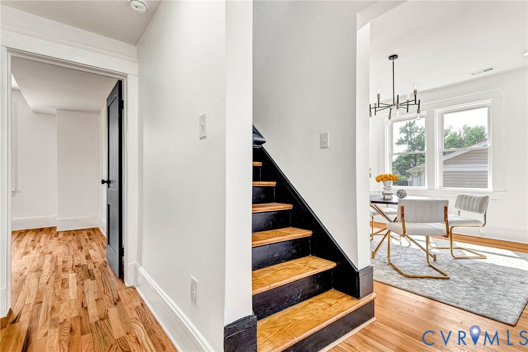 503 Pollock Street, Richmond, VA 23222 Hardwood flooring throughout, modern black interior doors, contemporary lighting fixture, and a built-in staircase