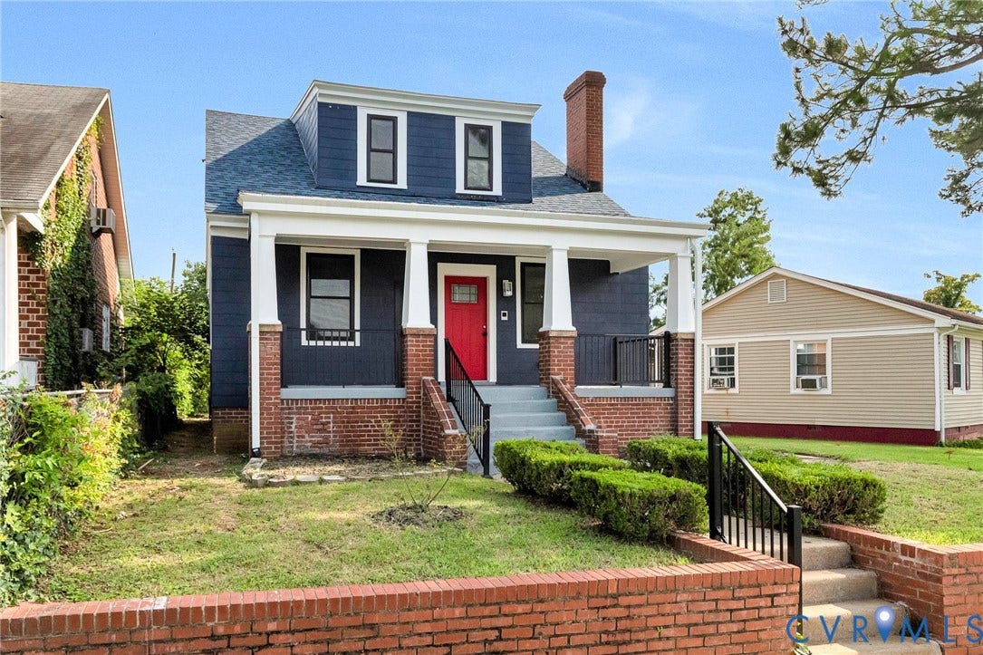 503 Pollock Street, Richmond, VA 23222 Dormer-style facade with blue siding and white trim