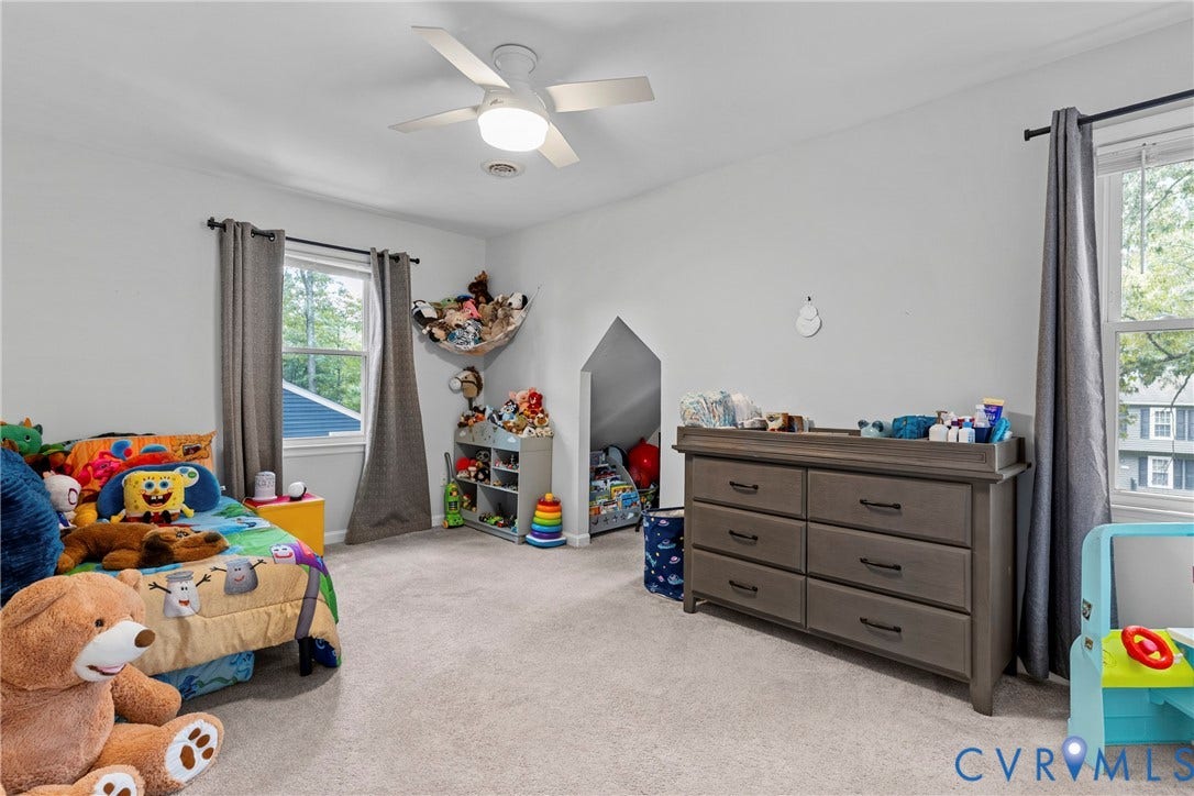 Soft gray carpeting with light gray wall paint