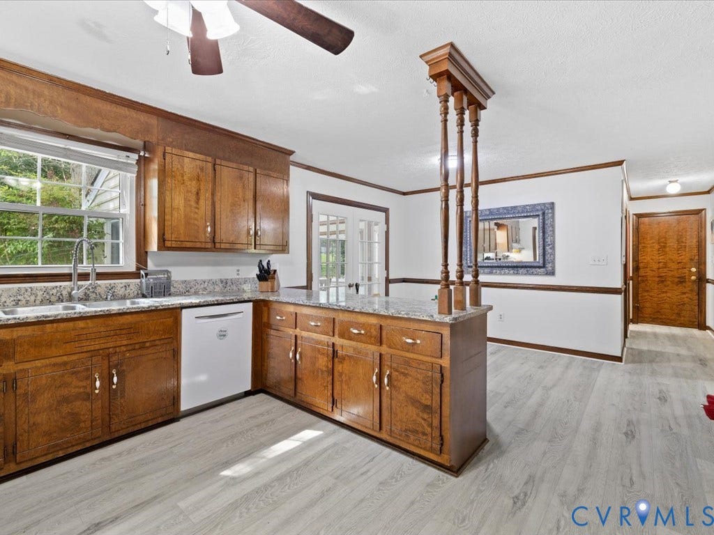 Wood-finish cabinetry with granite countertops