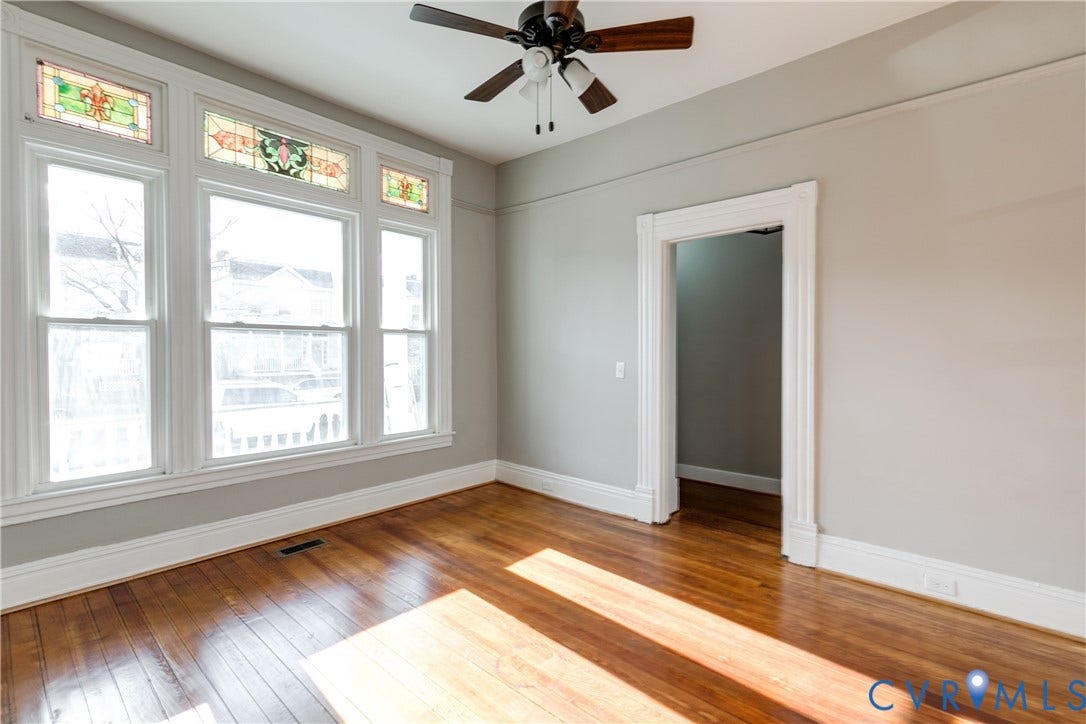 704 Chimborazo Boulevard, Chimborazo, Richmond, VA 23223 Hardwood flooring, decorative stained glass transoms, ceiling fan, and white trim molding