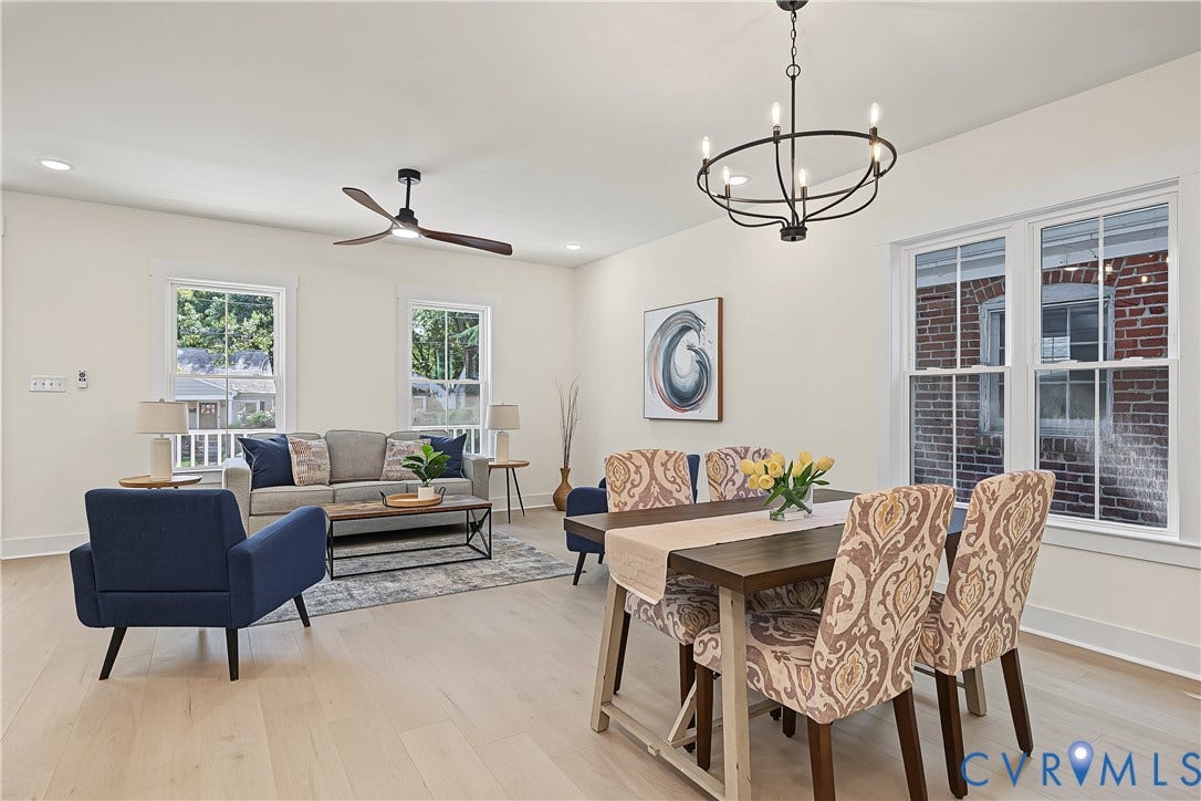 Recessed lighting, wood-finish flooring, white walls, and multiple windows