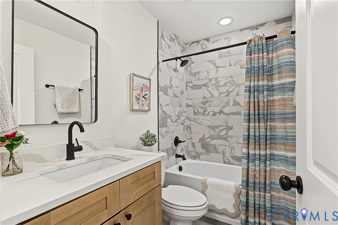 Quartz countertop with integrated rectangular sink and matte black faucet