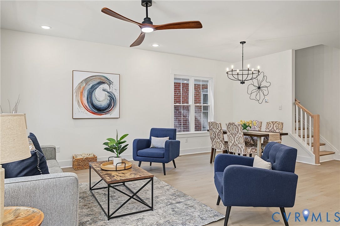 Recessed lighting, wood-finish flooring, and a modern ceiling fan in the living area