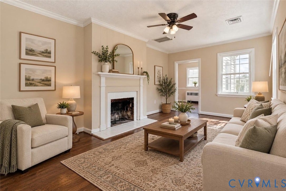 6227 Ellis Avenue, Henrico, VA 23228 Virtually staged. Hardwood-style flooring throughout, a central fireplace with a white mantel, crown molding, and a ceiling fan with integrated lighting